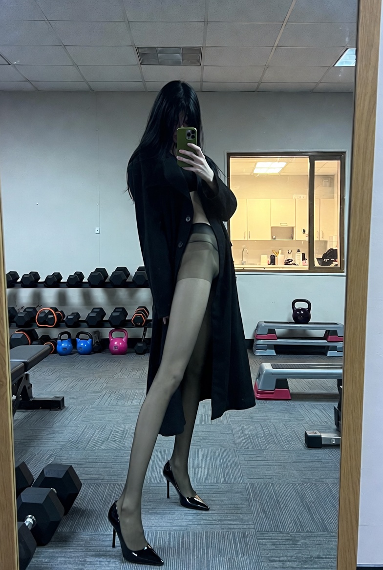 Silhouette of Chic: A Modern Gym Reflection